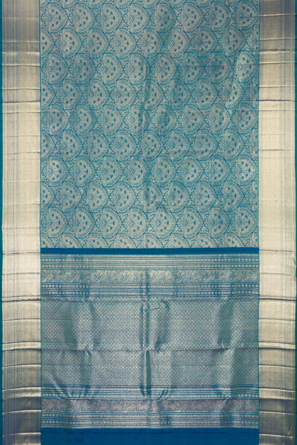 Flat view of Pure Silk Peacock Blue Dual Tone Kanchipuram Saree with Zari Brocade on the body and Zari Border. 