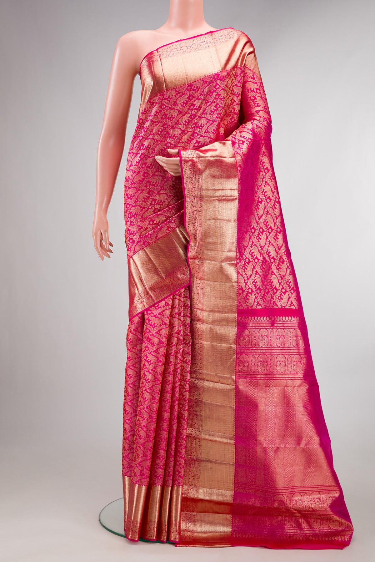 Pure Silk Dark Pink Dual Tone Kanchipuram Saree with Zari Brocade on the body and Zari Border.  displayed on a mannequin
