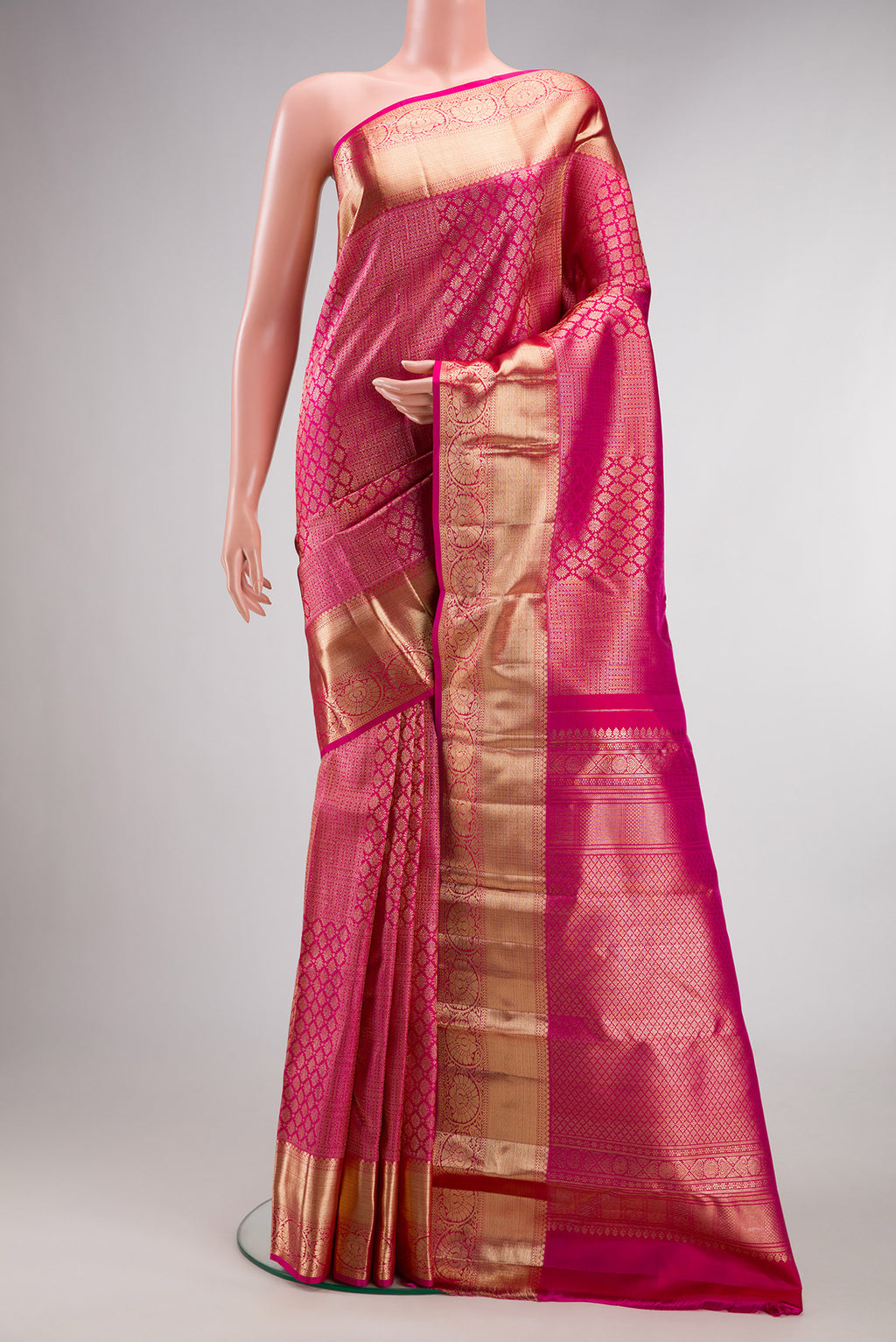 Pure Silk Pink Kanchipuram Saree with Zari Brocade on the body and Fancy Border.  displayed on a mannequin