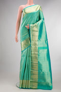 Pure Silk Sea Green Kanchipuram Saree with Zari Brocade on the body and Zari Border.  displayed on a mannequin