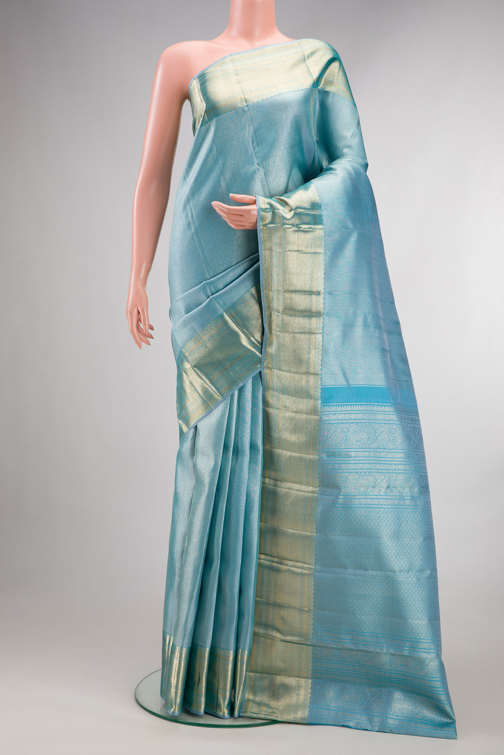 Pure Silk Sky Blue Kanchipuram Saree with Zari Brocade on the body and Zari Border.  displayed on a mannequin
