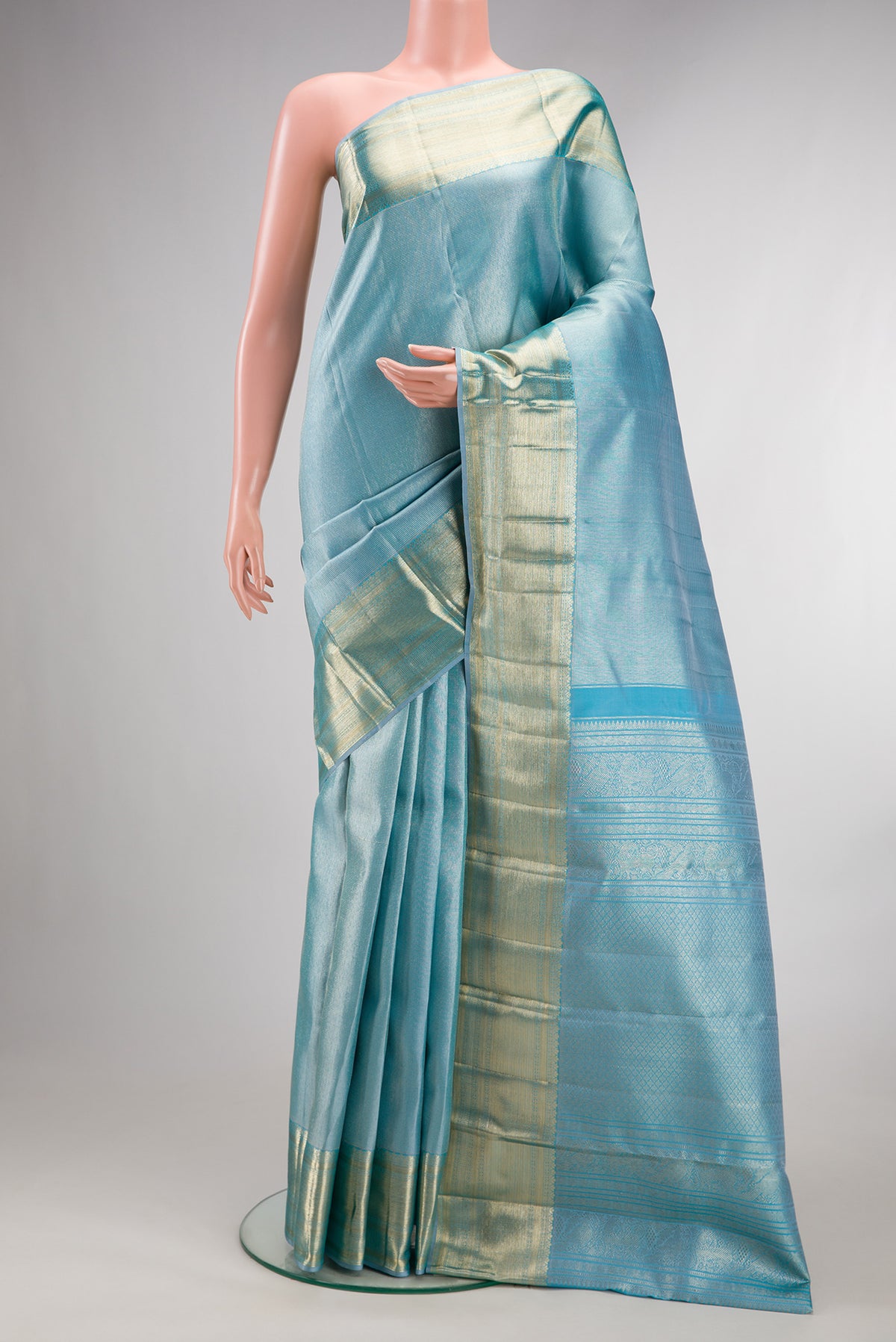 Pure Silk Sky Blue Kanchipuram Saree with Zari Brocade on the body and Zari Border.  displayed on a mannequin