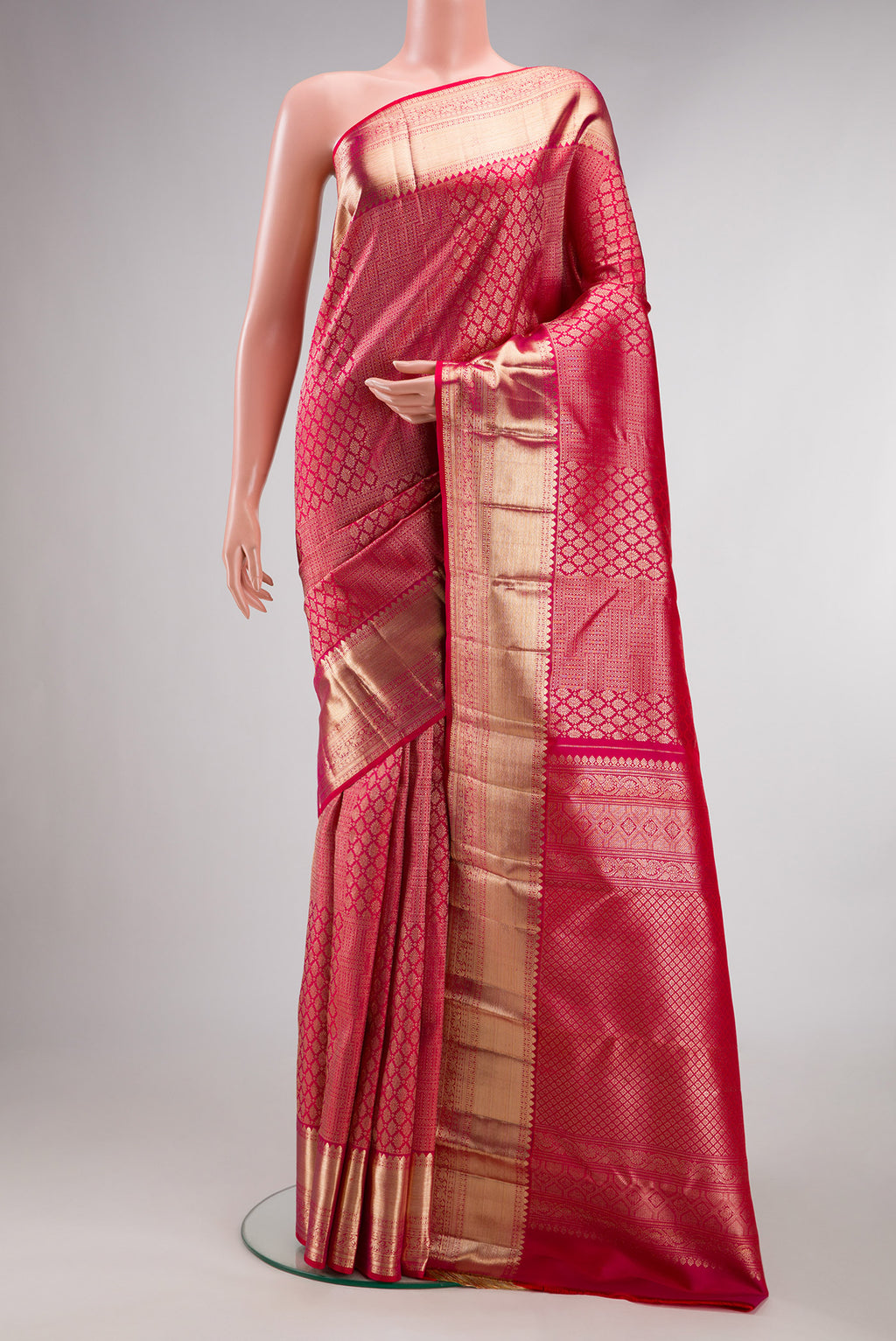 Pure Silk Pink Dual Tone Kanchipuram Saree with Zari Brocade on the body and Zari Border.  displayed on a mannequin