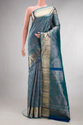 Pure Silk Peacock Blue Dual Tone Kanchipuram Saree with Zari Brocade on the body and Fancy Border.  displayed on a mannequin