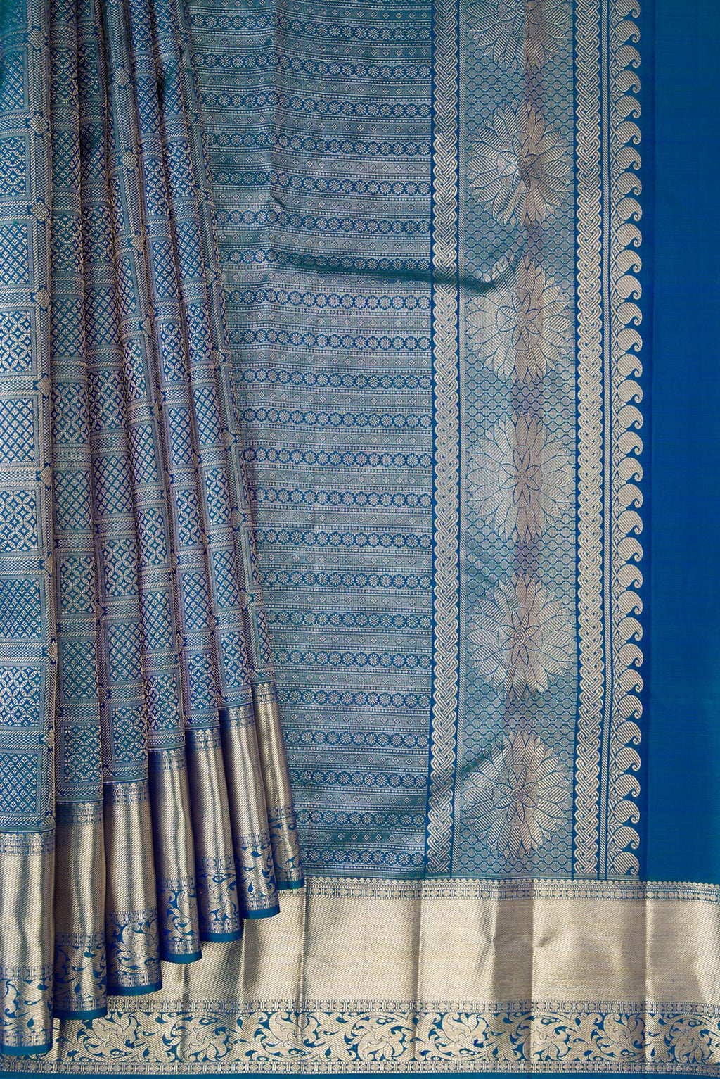 Pleats and pallu of Pure Silk Peacock Blue Dual Tone Kanchipuram Saree with Zari Brocade on the body and Fancy Border. 