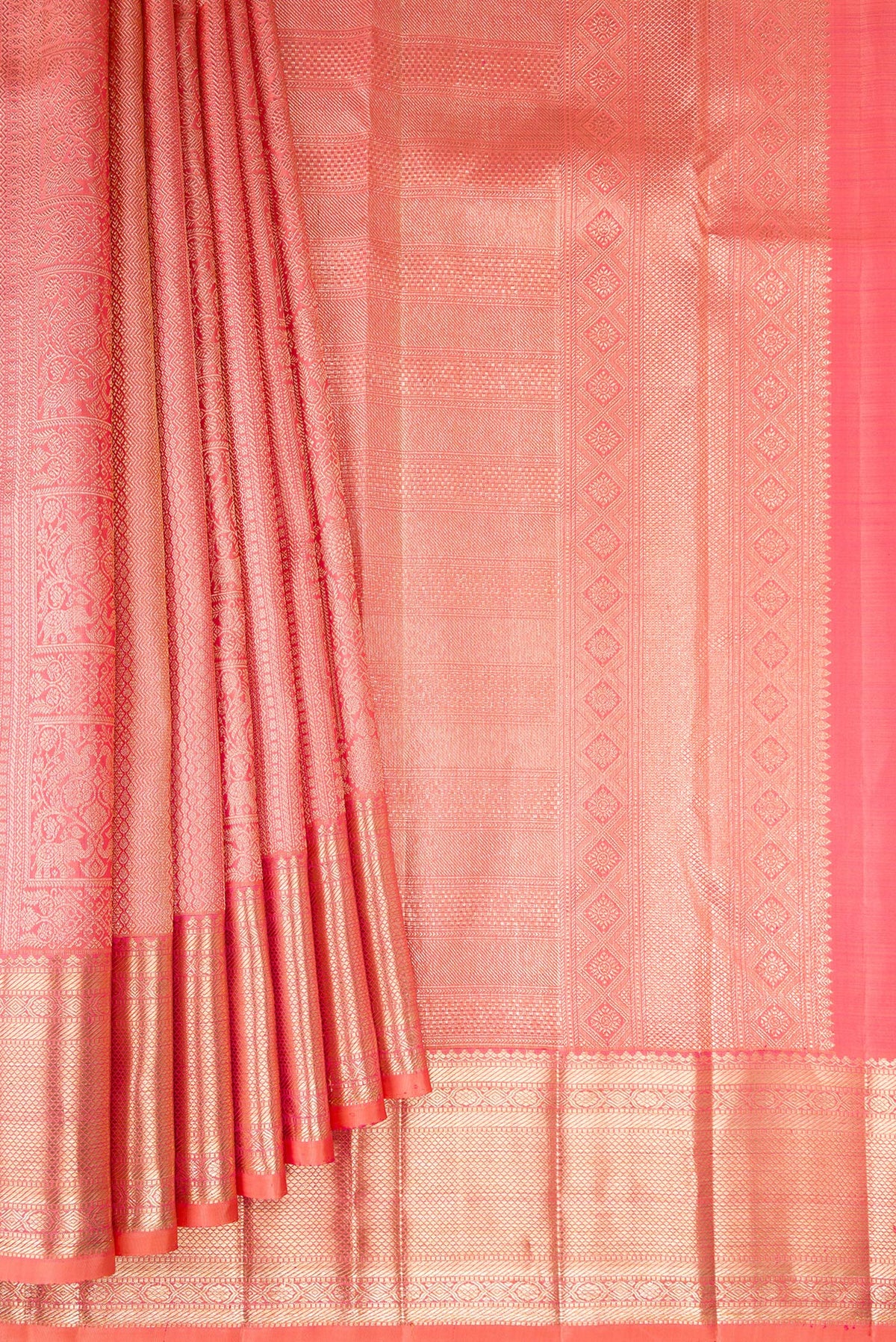 Pleats and pallu of Pure Silk Golden Peach Dual Tone Kanchipuram Saree with Zari Brocade on the body and Zari Border. 