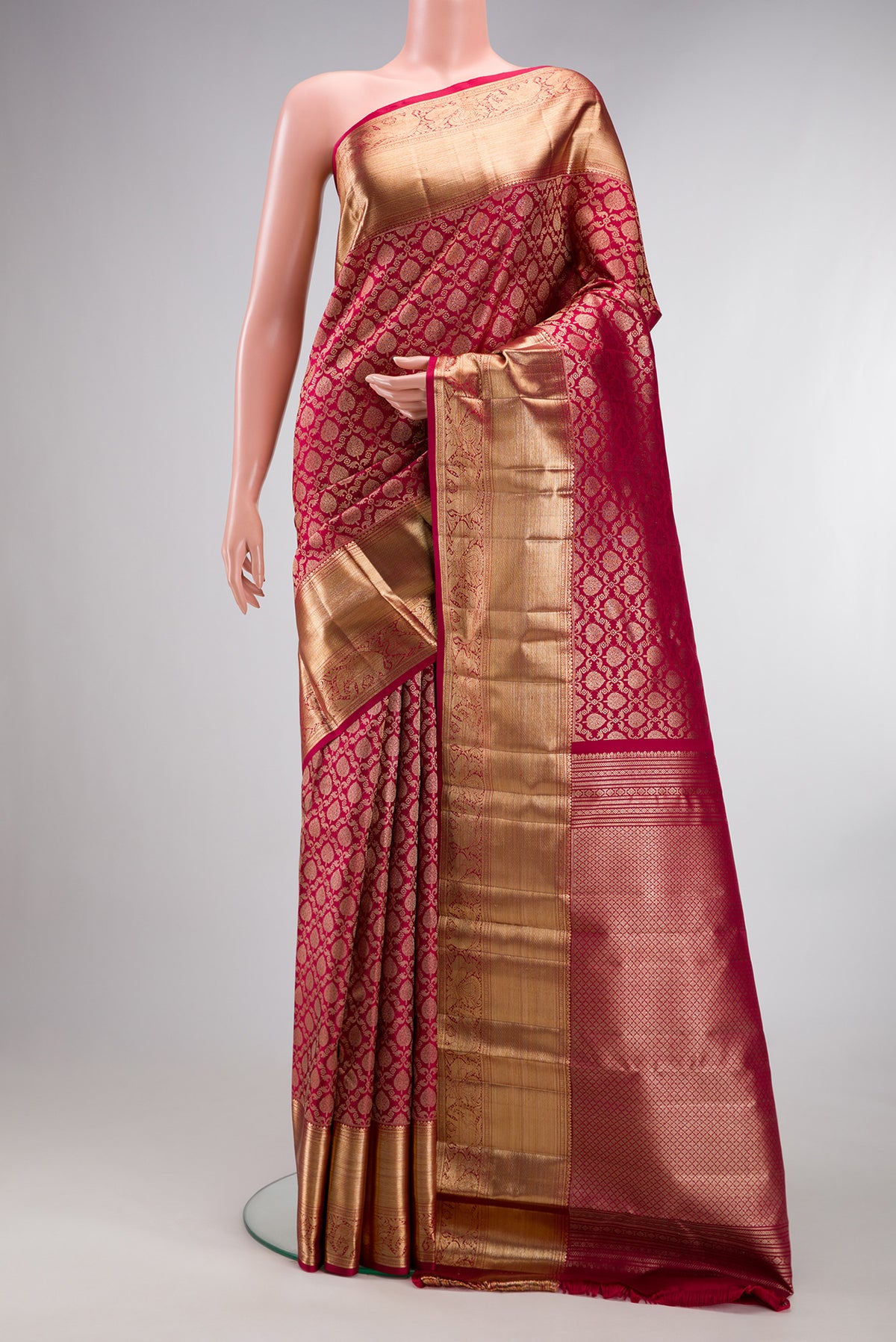 Pure Silk Deep Red Dual Tone Kanchipuram Saree with Zari Brocade on the body and Zari Border.  displayed on a mannequin