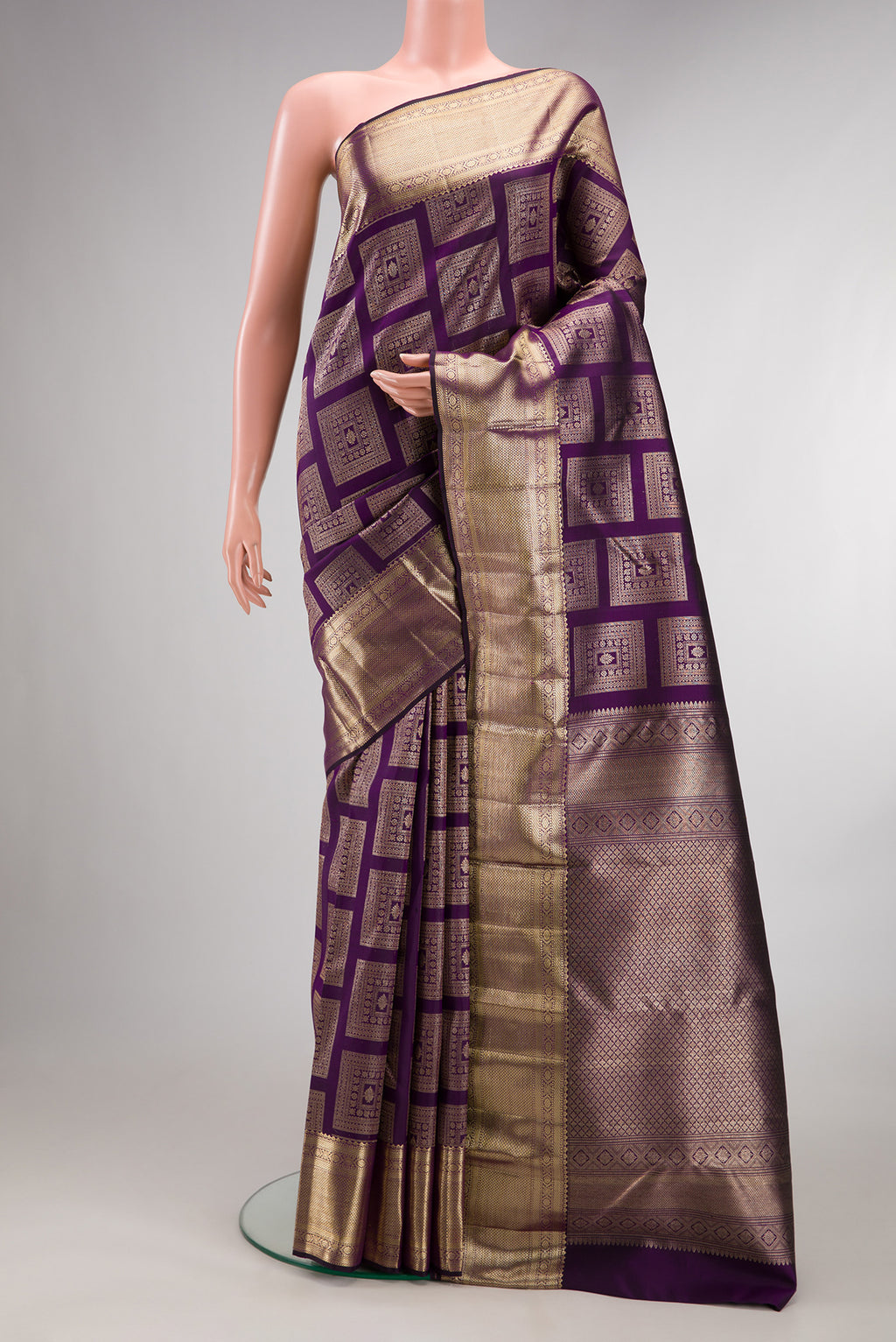 Pure Silk Violet Kanchipuram Saree with Zari Brocade on the body and Zari Border.  displayed on a mannequin