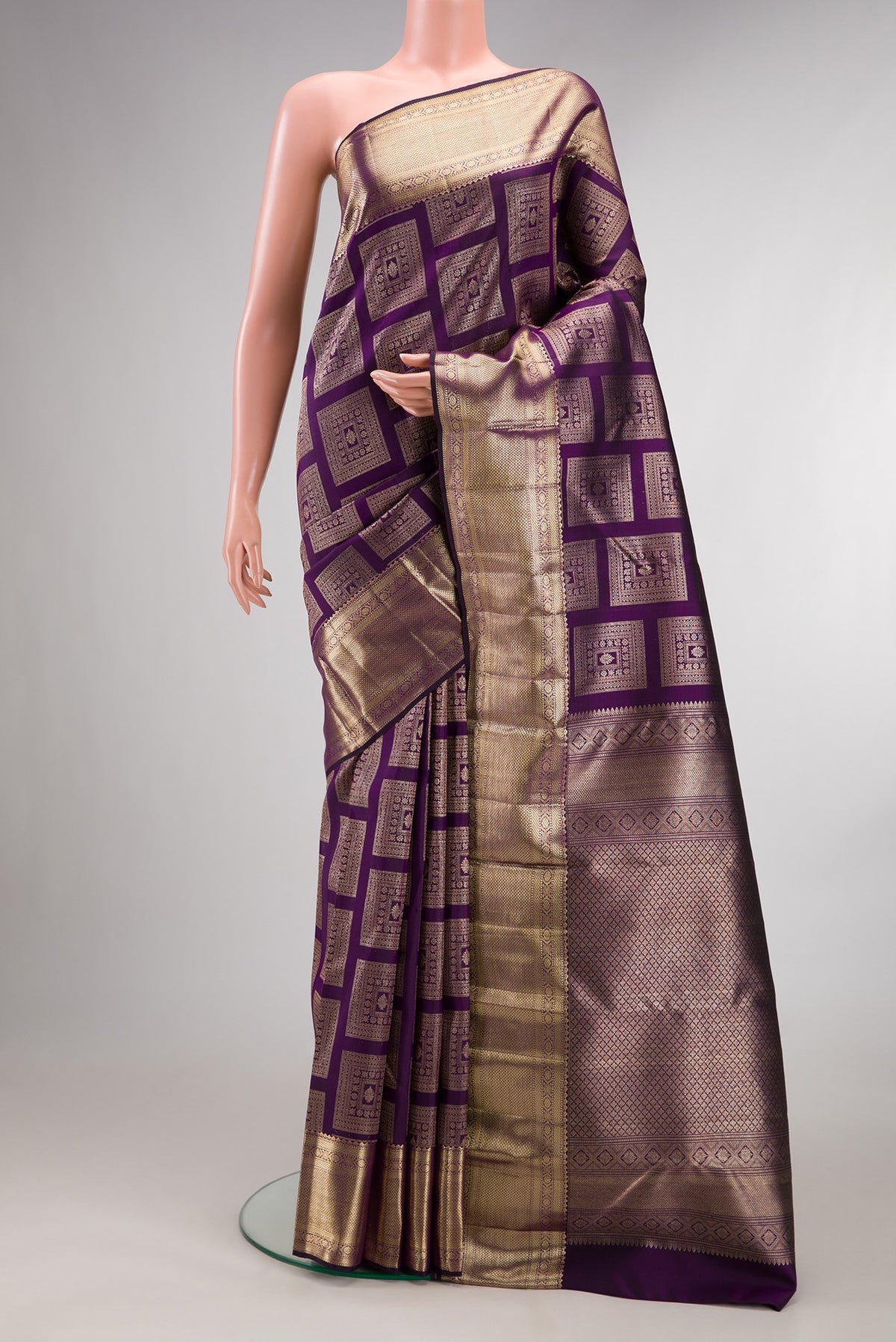 Pure Silk Violet Kanchipuram Saree with Zari Brocade on the body and Zari Border.  displayed on a mannequin