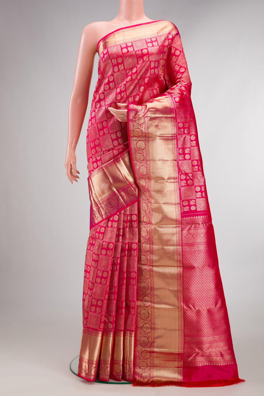 Pure Silk Dark Pink Kanchipuram Saree with Zari Brocade on the body and Zari Border.  displayed on a mannequin