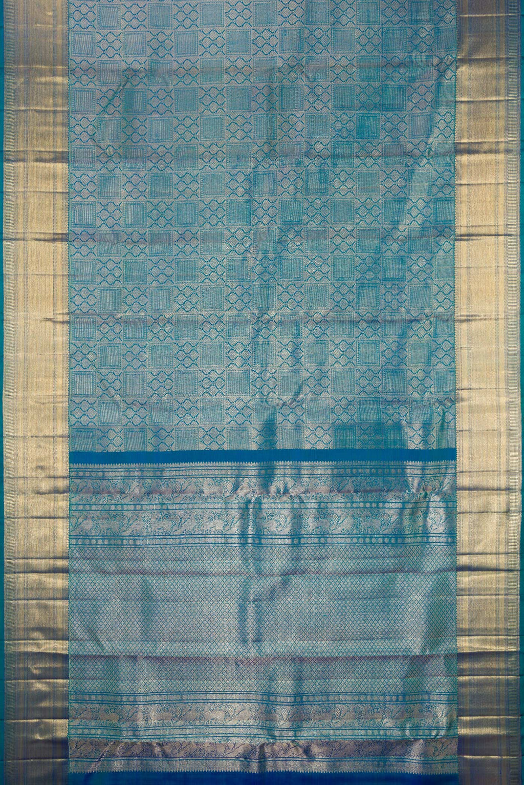 Flat view of Pure Silk Peacock Blue Dual Tone Kanchipuram Saree with Zari Brocade on the body and Zari Border. 