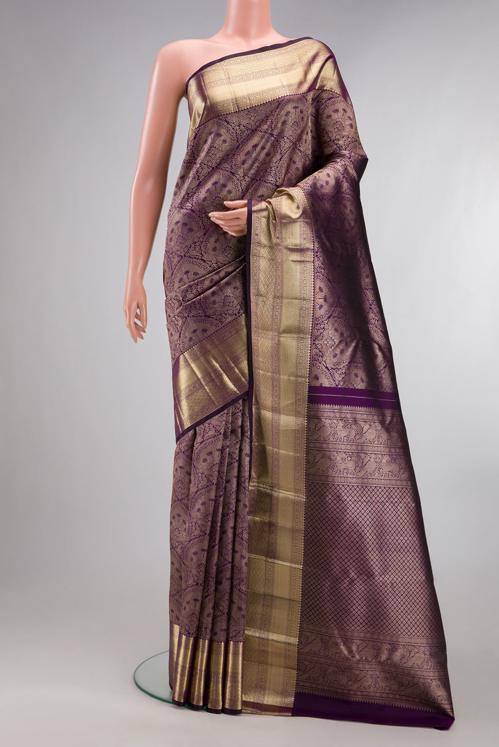 Pure Silk Purple Kanchipuram Saree with Zari Brocade on the body and Zari Border.  displayed on a mannequin