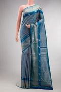 Pure Silk Peacock Blue Kanchipuram Saree with Zari Brocade on the body and Fancy Border.  displayed on a mannequin