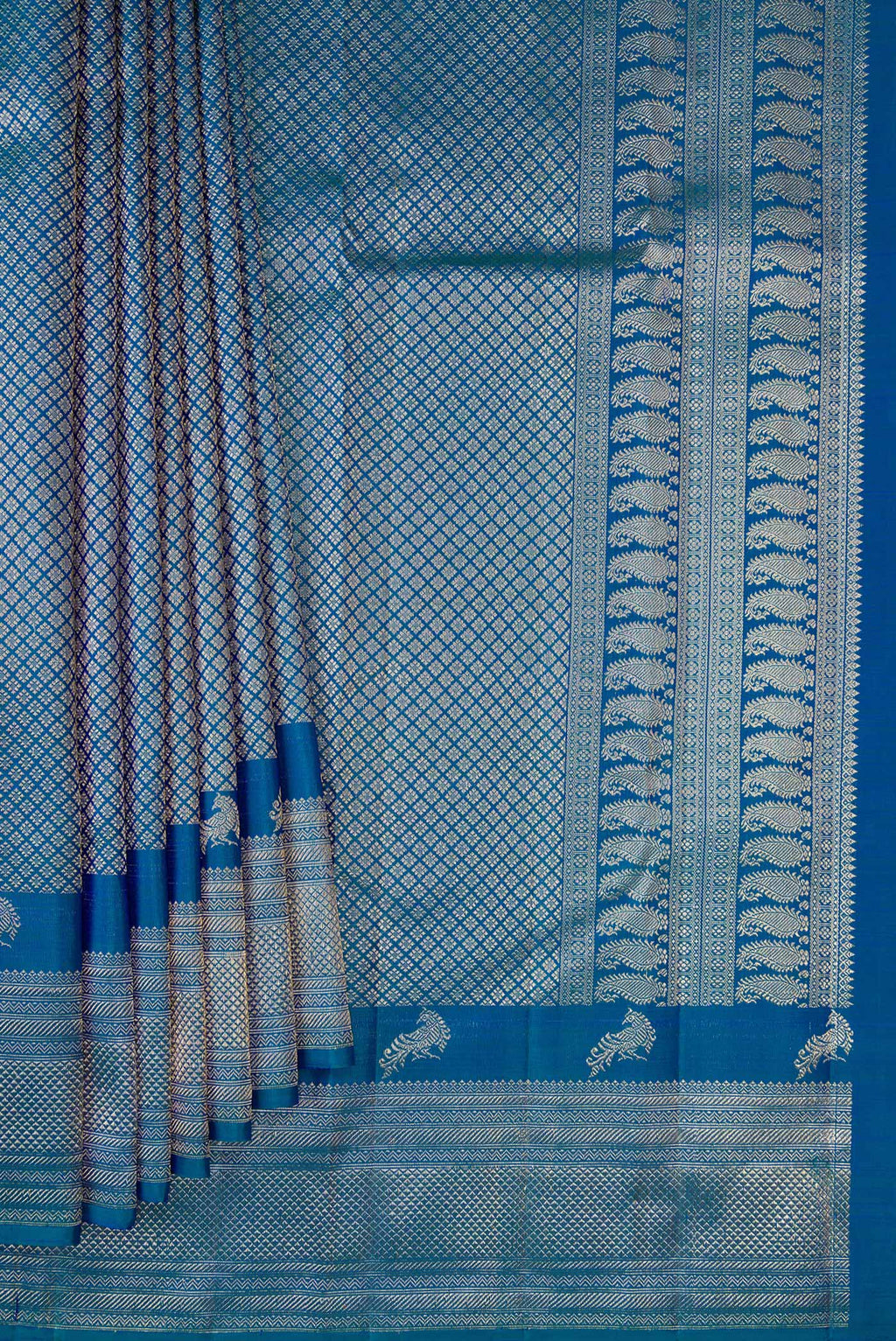 Pleats and pallu of Pure Silk Peacock Blue Kanchipuram Saree with Zari Brocade on the body and Fancy Border. 