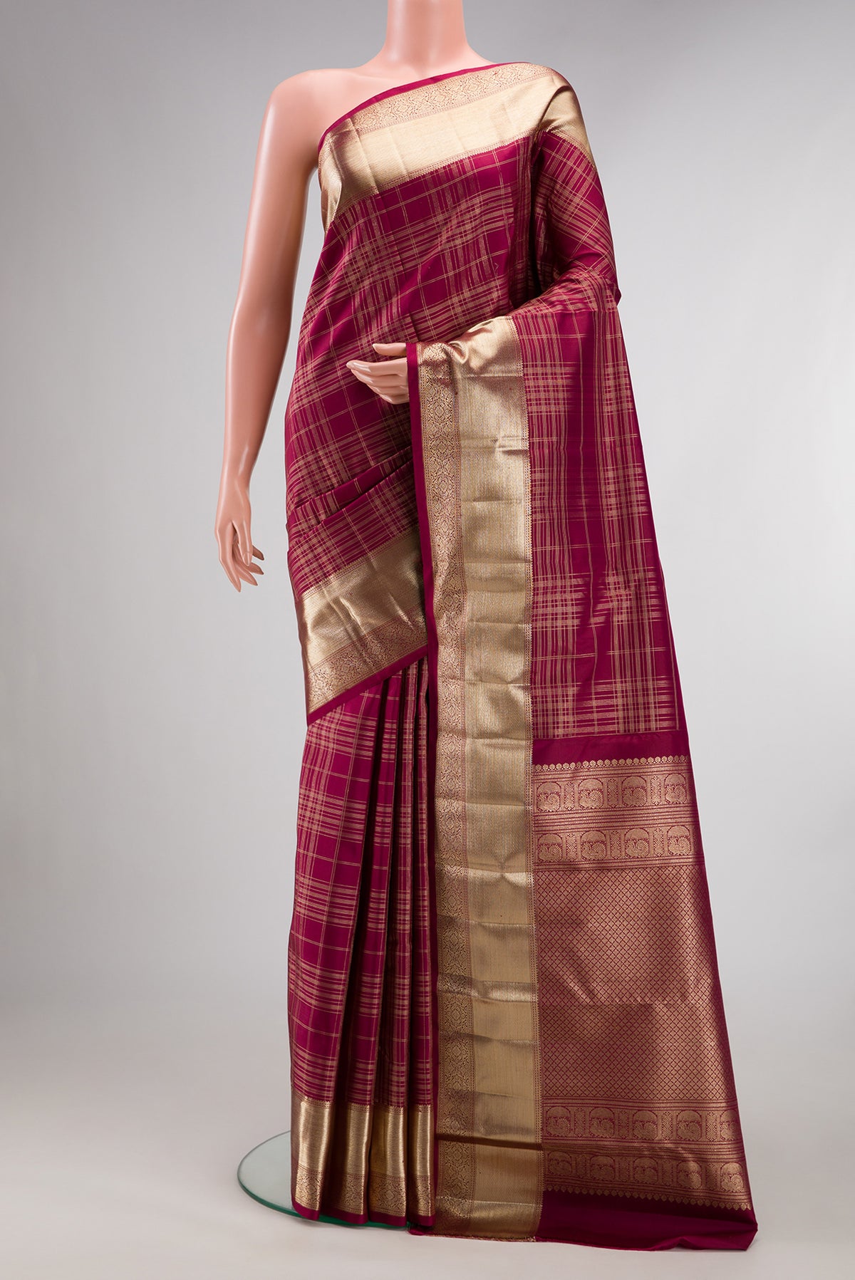 Pure Silk Maroon Dual Tone Kanchipuram Saree with Checked design on the body and Zari Border.  displayed on a mannequin