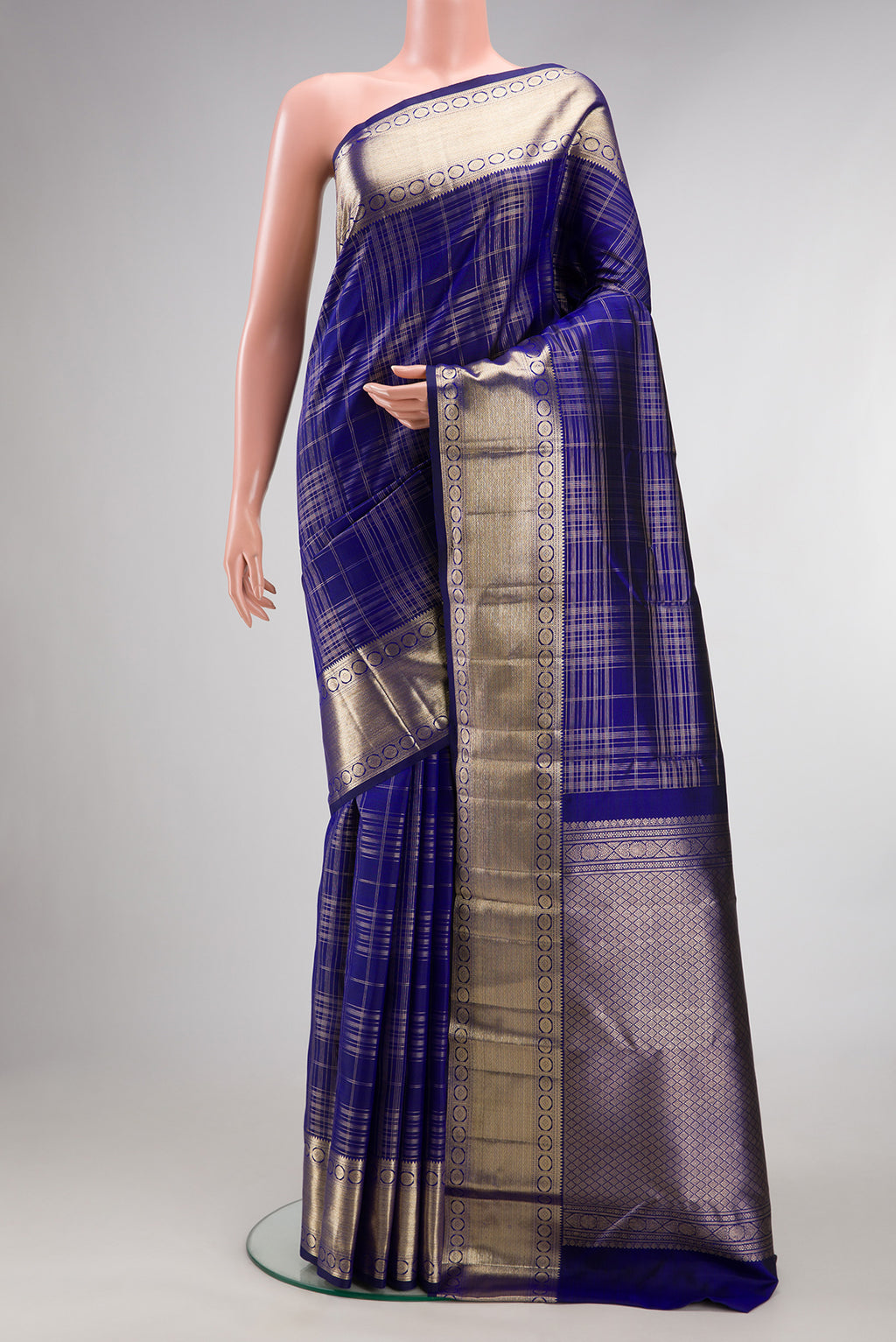 Pure Silk Royal Blue Kanchipuram Saree with Checked design on the body and Zari Border.  displayed on a mannequin