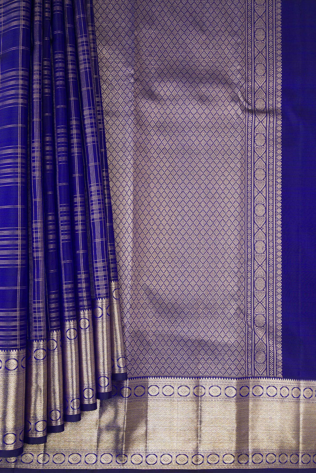 Pleats and pallu of Pure Silk Royal Blue Kanchipuram Saree with Checked design on the body and Zari Border. 