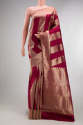 Pure Silk Maroon Kanchipuram Saree with Zari Butta on the body and Zari Border.  displayed on a mannequin