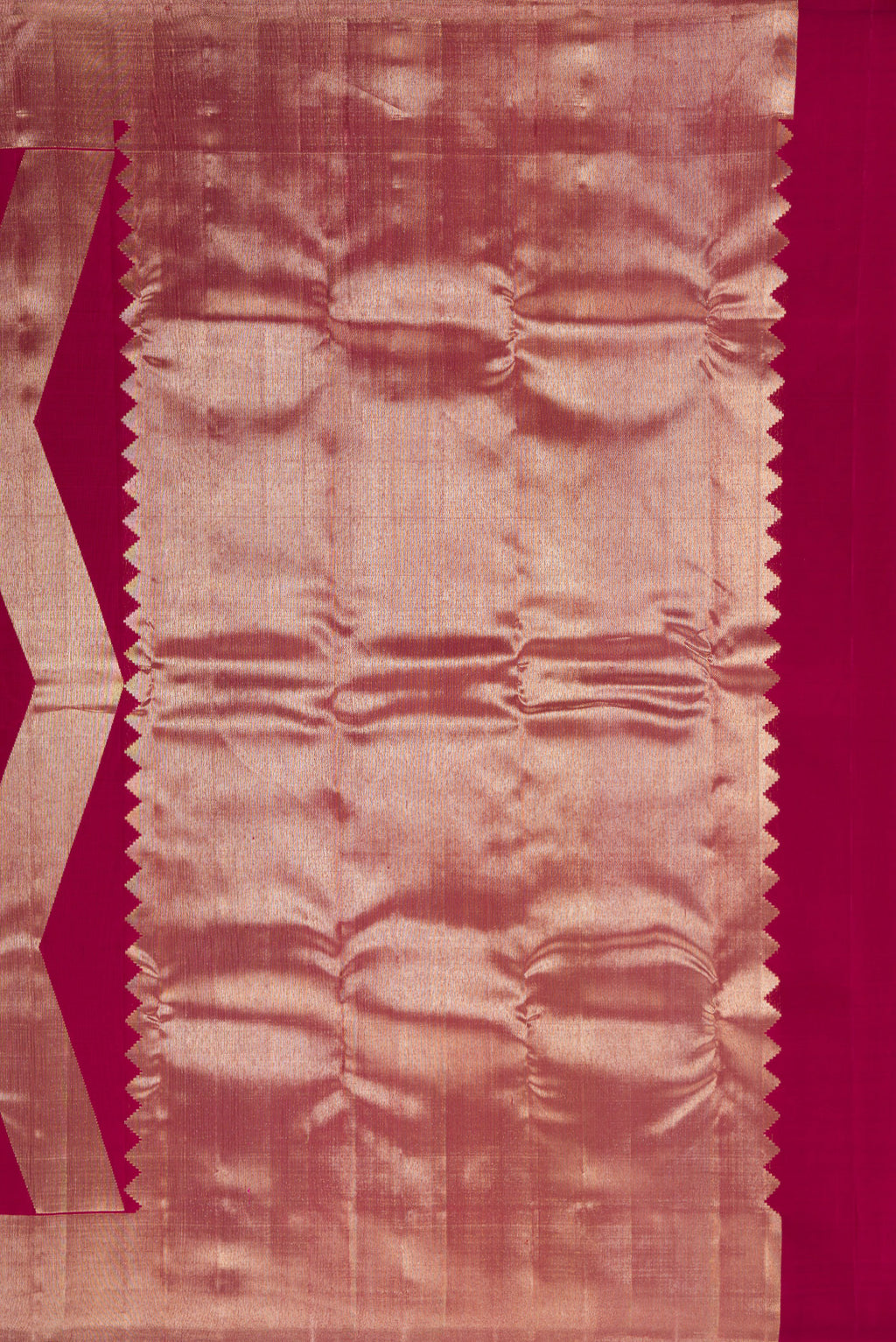 Close up image of the pallu of Pure Silk Maroon Kanchipuram Saree with Zari Butta on the body and Zari Border. 