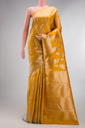 Pure Silk Mustard Kanchipuram Saree with Zari Brocade on the body and Zari Border.  displayed on a mannequin