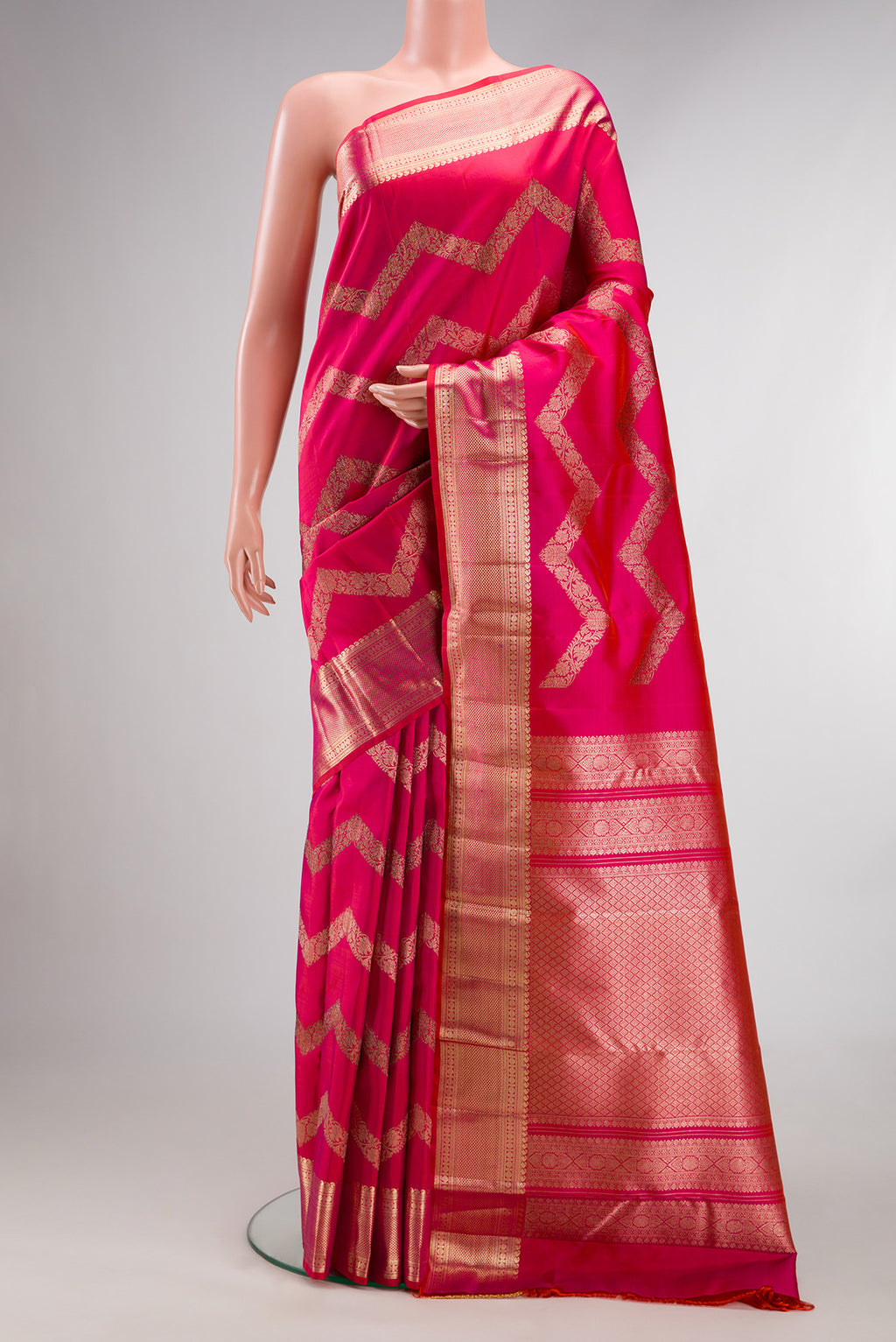 Pure Silk Pink Dual Tone Kanchipuram Saree with Stripes on the body and Zari Border.  displayed on a mannequin