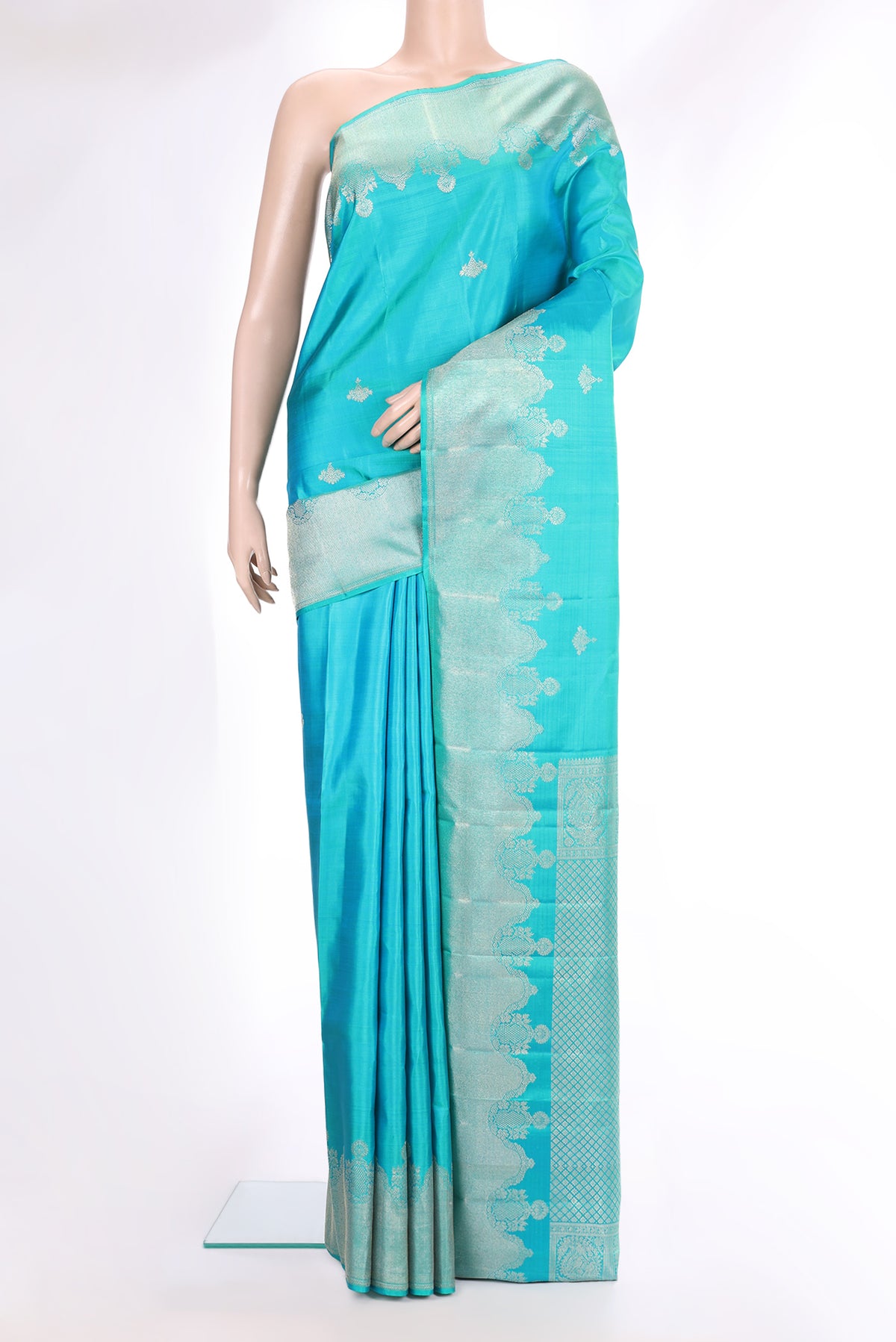 Pure Silk Turquoise Kanjivaram Saree with Zari Butta on the body and Fancy Border.  displayed on a mannequin