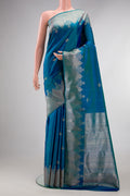 Pure Silk Peacock Blue Dual Tone Kanjivaram Saree with Zari Butta on the body and Fancy Border.  displayed on a mannequin