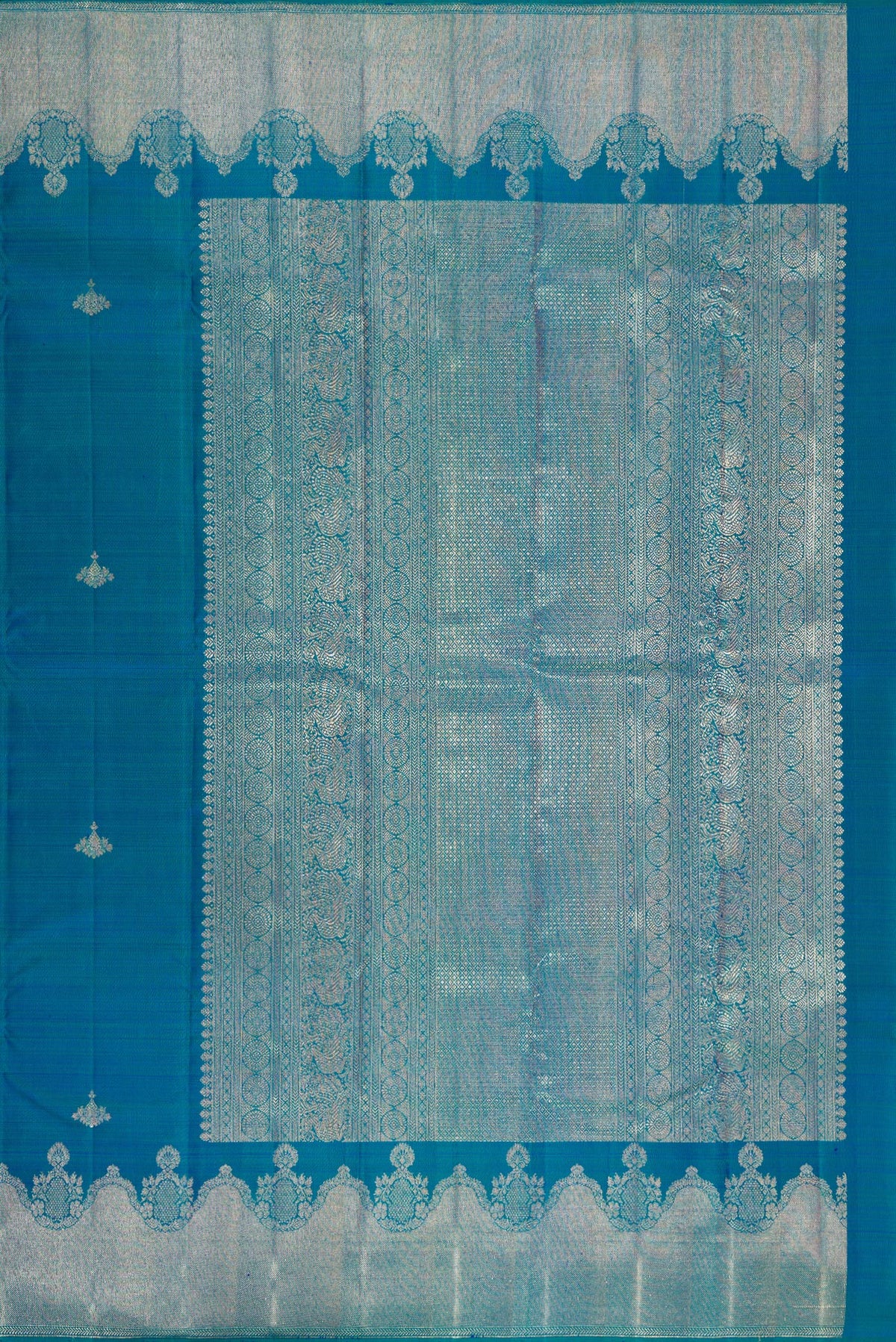 Close up image of the pallu of Pure Silk Peacock Blue Dual Tone Kanjivaram Saree with Zari Butta on the body and Fancy Border. 