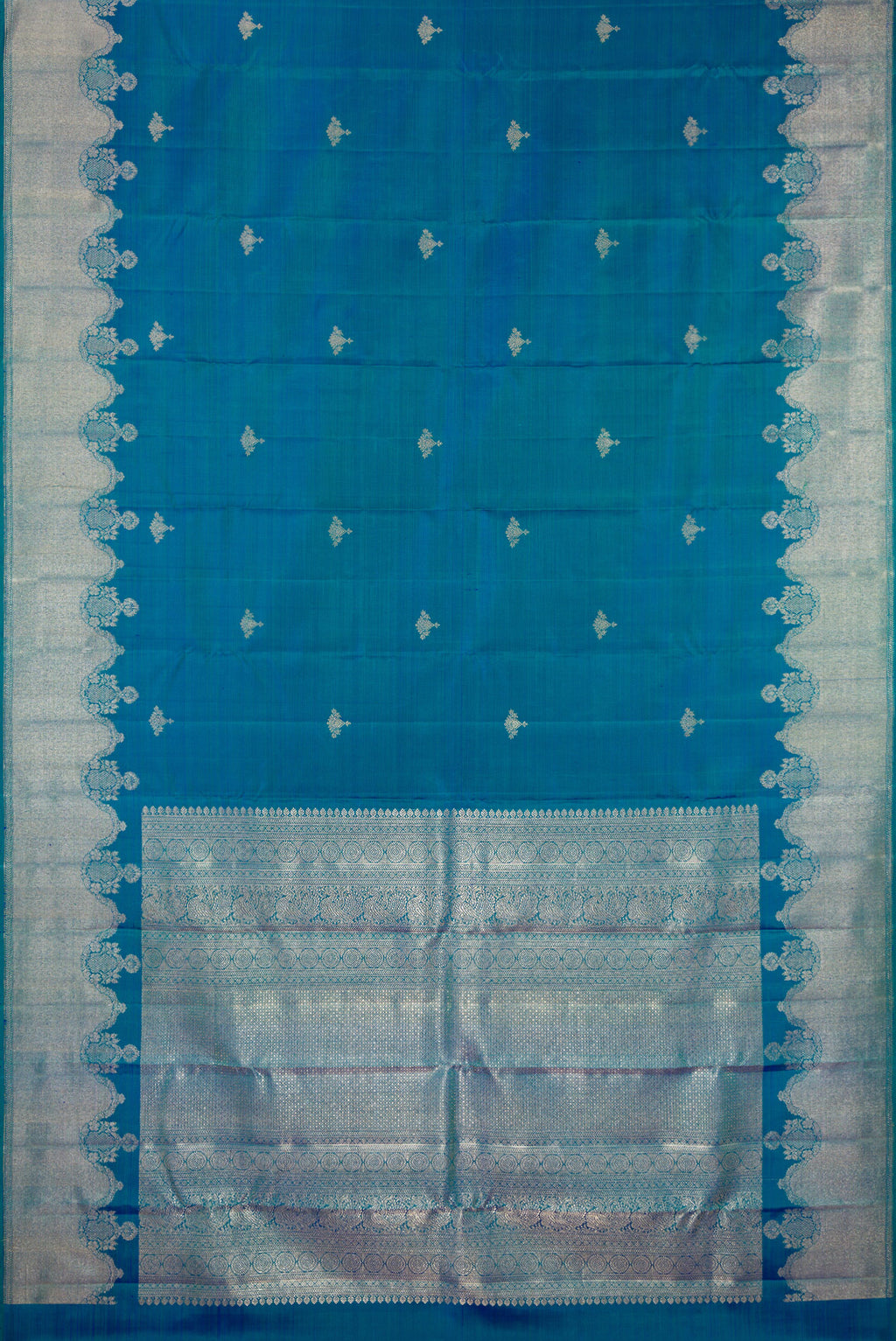 Flat view of Pure Silk Peacock Blue Dual Tone Kanjivaram Saree with Zari Butta on the body and Fancy Border. 