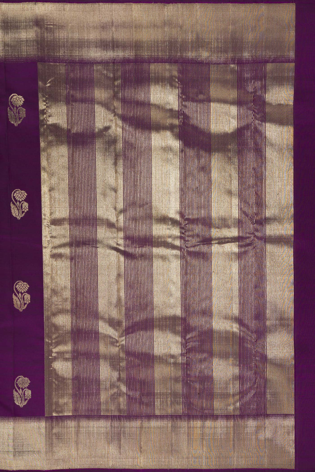 Close up image of the pallu of Pure Silk Purple Kanjivaram Saree with Zari Butta on the body and Zari Border. 