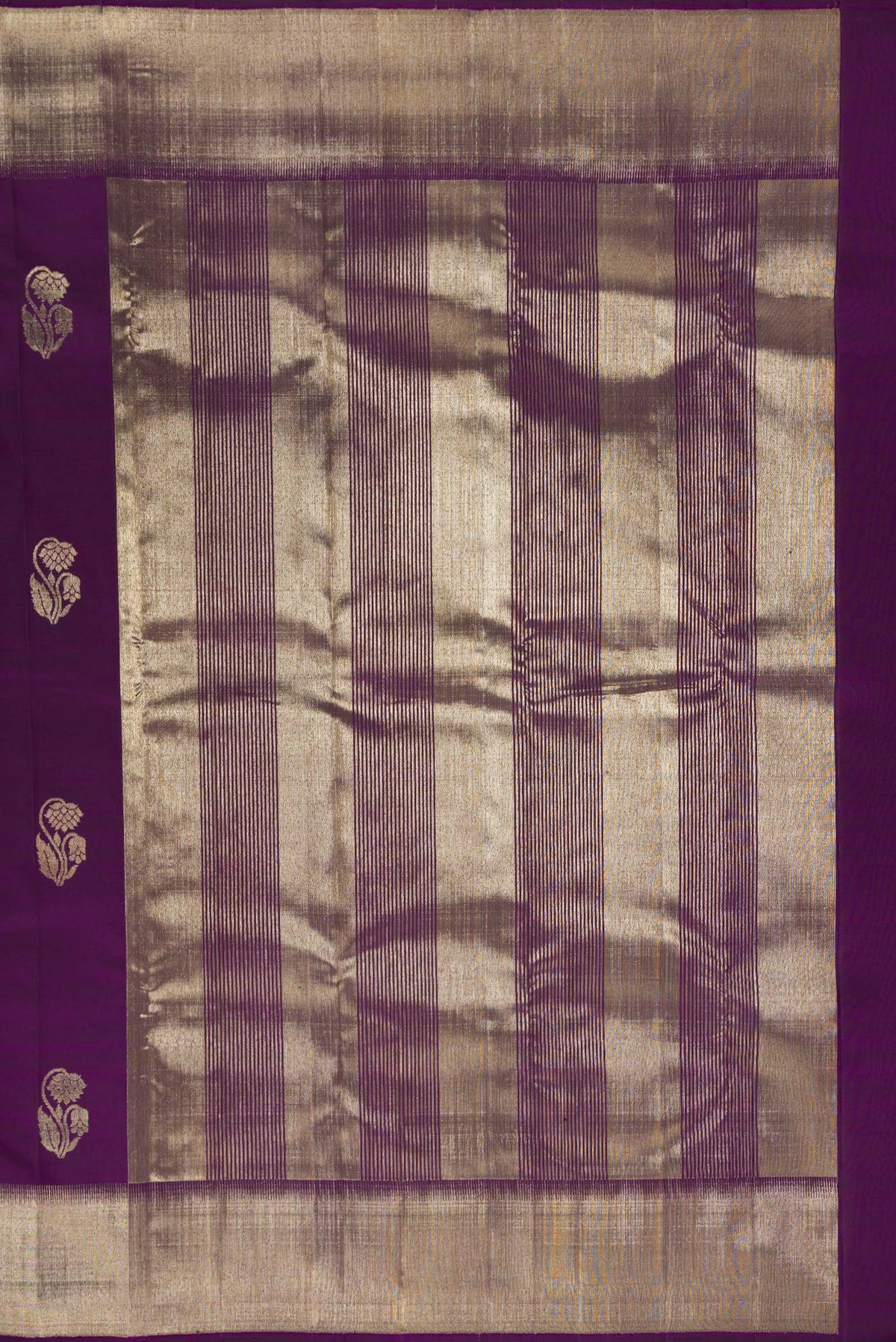 Close up image of the pallu of Pure Silk Purple Kanjivaram Saree with Zari Butta on the body and Zari Border. 
