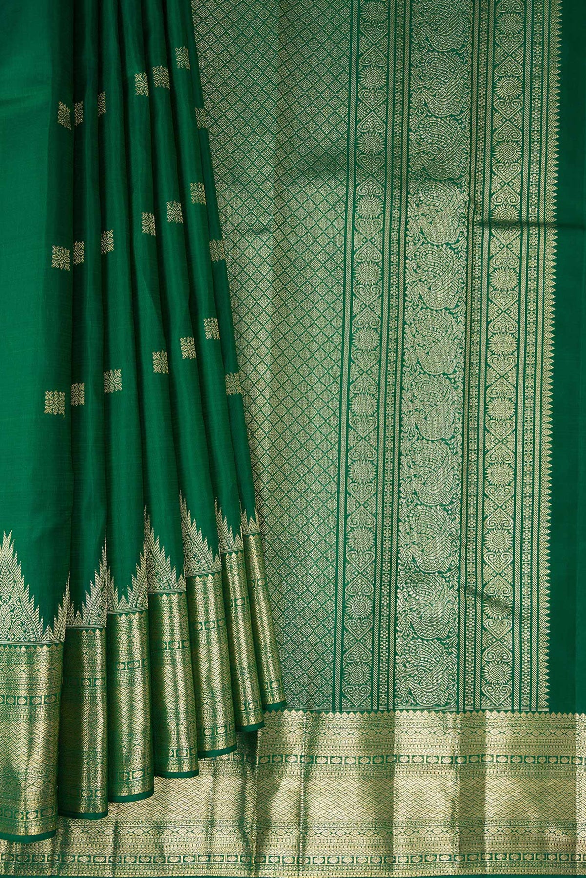 Pleats and pallu of Pure Silk Green Kanjivaram Saree with Zari Butta on the body and Temple Border. 
