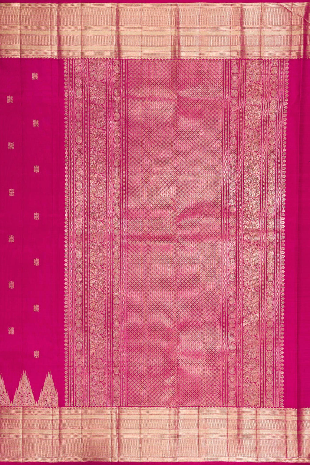 Close up image of the pallu of Pure Silk Rani Pink Kanjivaram Saree with Zari Butta on the body and Zari Border. 