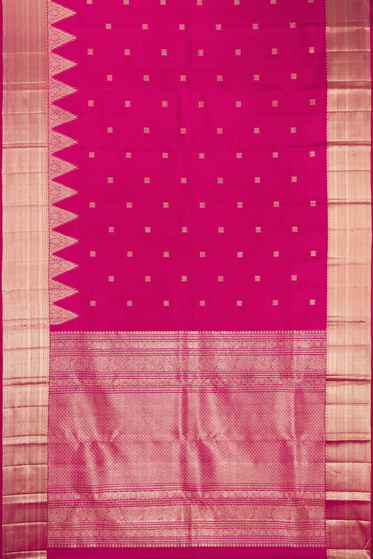 Flat view of Pure Silk Rani Pink Kanjivaram Saree with Zari Butta on the body and Zari Border. 