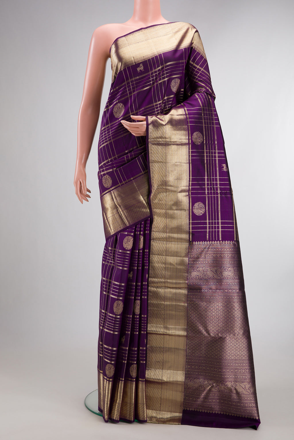 Pure Silk Violet Dual Tone Kanchipuram Saree with Checked design on the body and Zari Border.  displayed on a mannequin