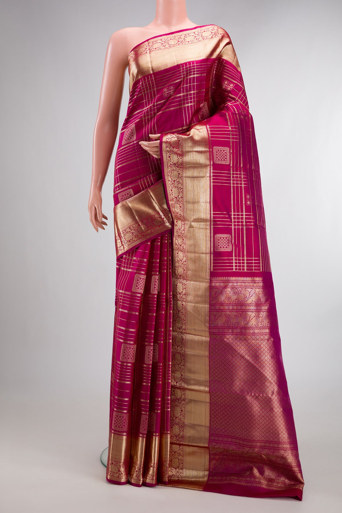 Pure Silk Dark Pink Kanchipuram Saree with Checked design on the body and Zari Border.  displayed on a mannequin