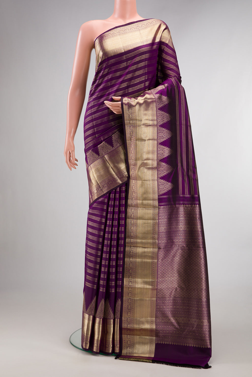 Pure Silk Purple Kanchipuram Saree with Stripes on the body and Zari Border.  displayed on a mannequin