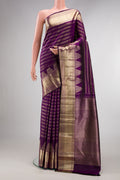Pure Silk Purple Kanchipuram Saree with Stripes on the body and Zari Border.  displayed on a mannequin