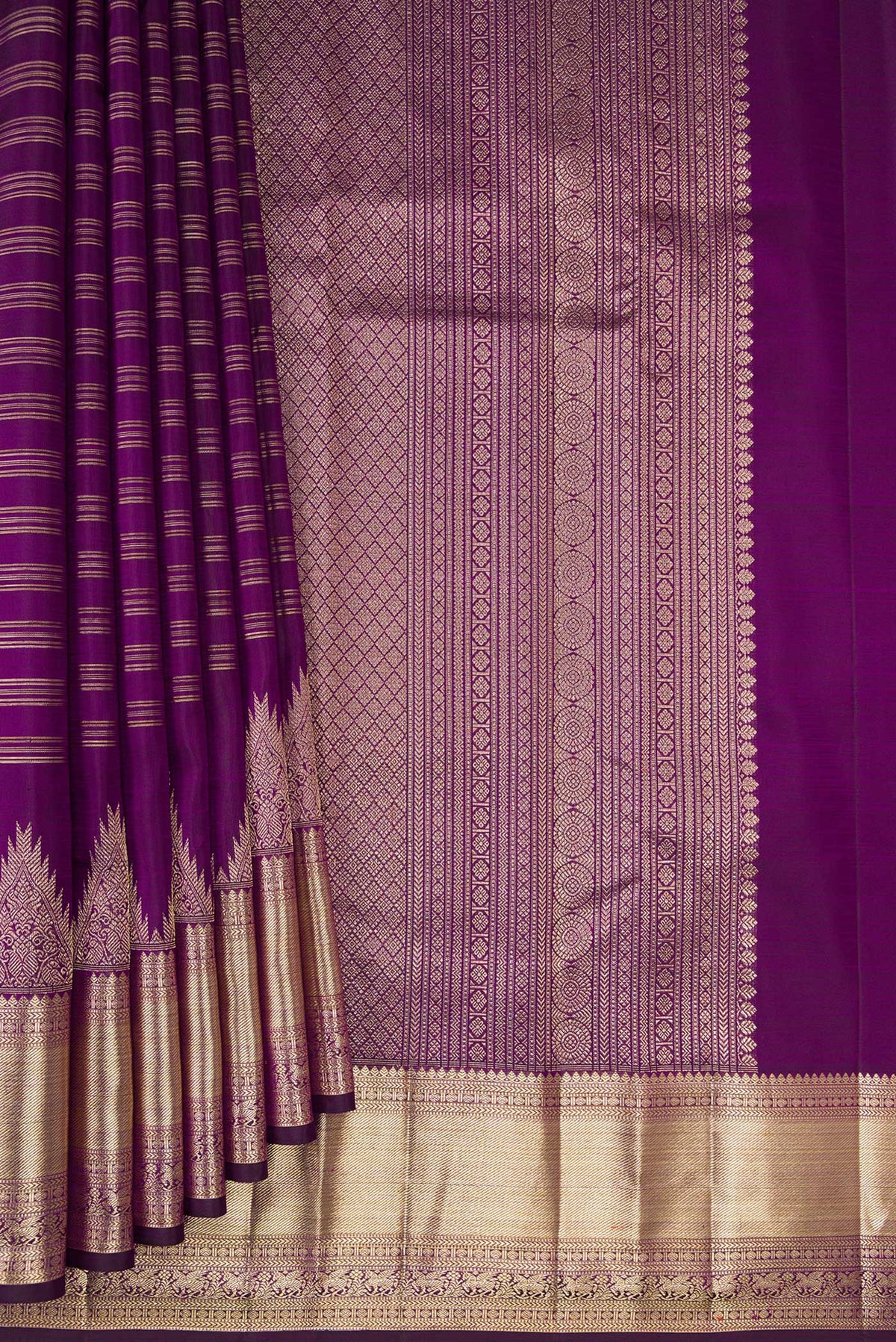 Pleats and pallu of Pure Silk Purple Kanchipuram Saree with Stripes on the body and Zari Border. 