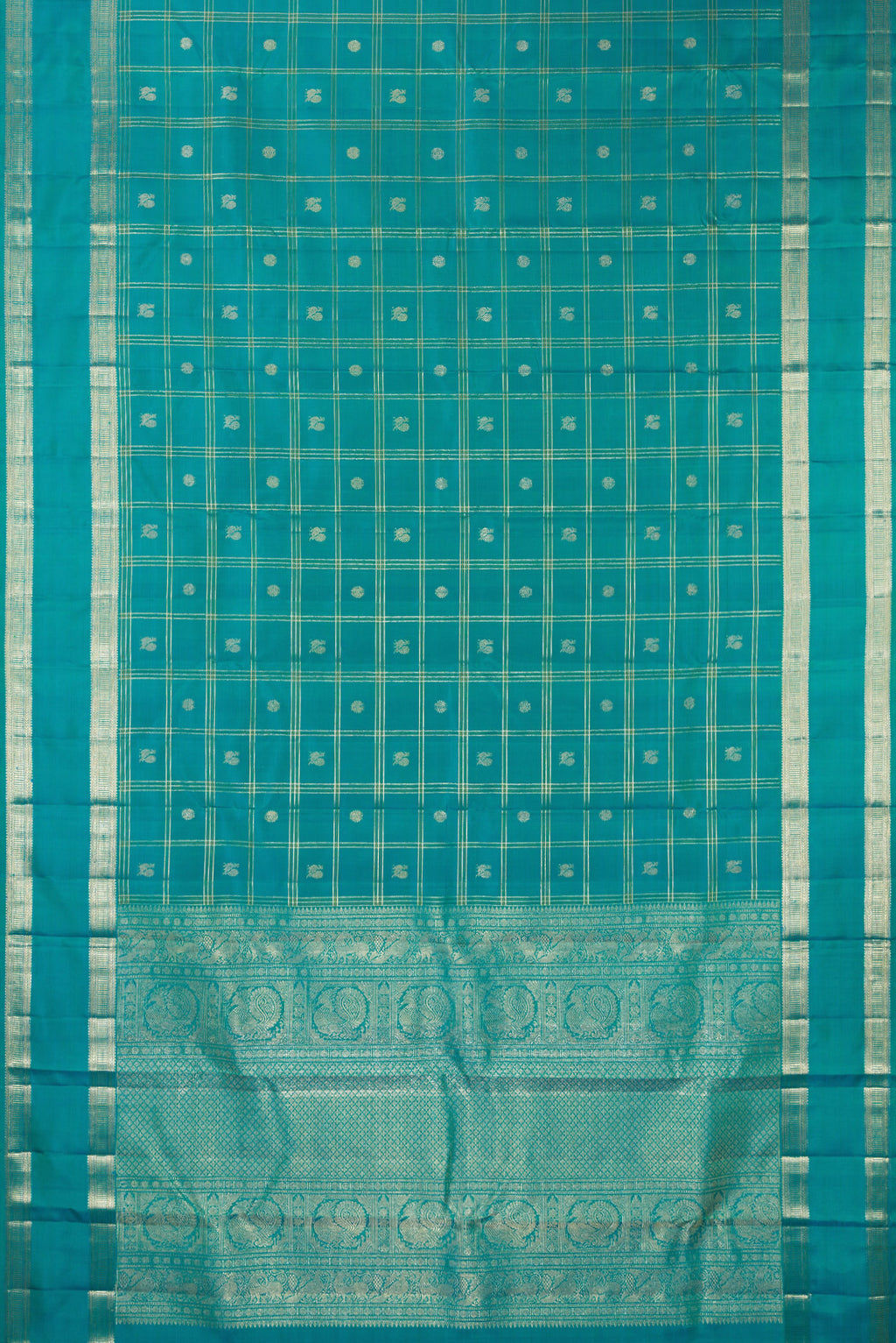 Flat view of Pure Silk Turquoise Kanchipuram Saree with Checked design on the body and Zari Border. 