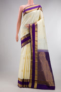 Pure Silk Off White Kanchipuram Saree with Zari Butta on the body and Zari Border.  displayed on a mannequin