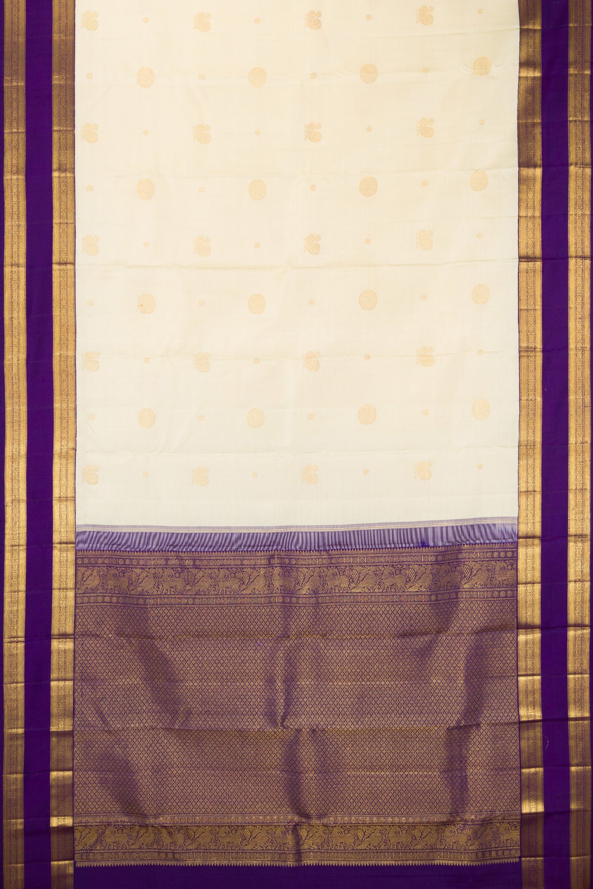 Flat view of Pure Silk Off White Kanchipuram Saree with Zari Butta on the body and Zari Border. 