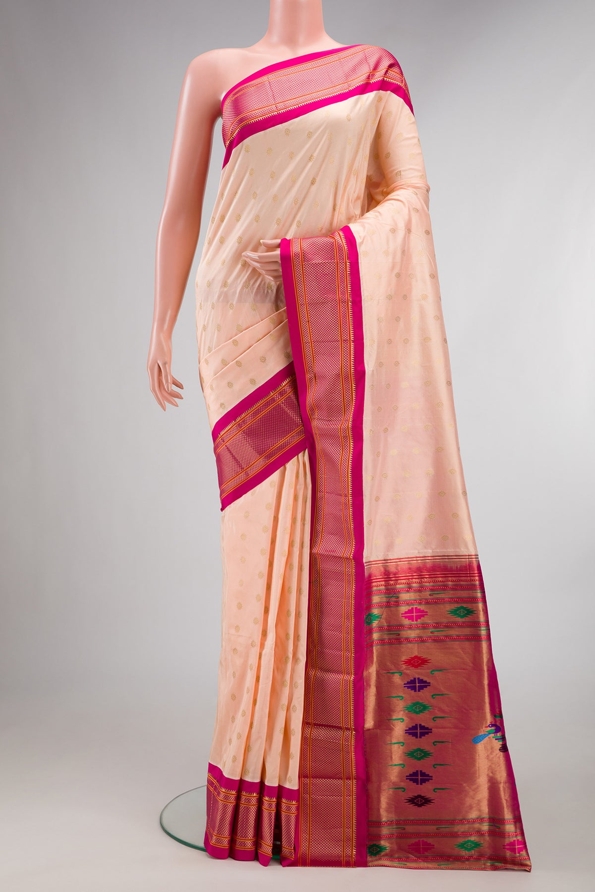 Pure Silk Peach Paithani Saree with Zari Butta on the body and Zari Border.  displayed on a mannequin