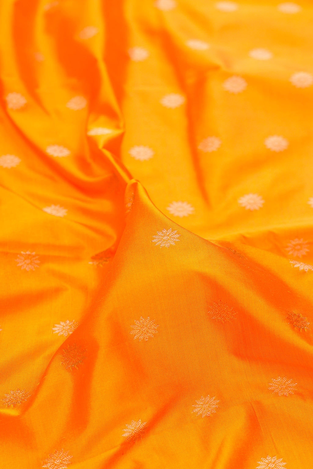 Close up of Pure Silk Yellow Dual Tone Paithani Saree with Zari Butta on the body and Zari Border.  displaying folds