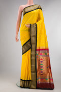 Pure Silk Yellow Paithani Saree with Zari Butta on the body and Zari Border.  displayed on a mannequin