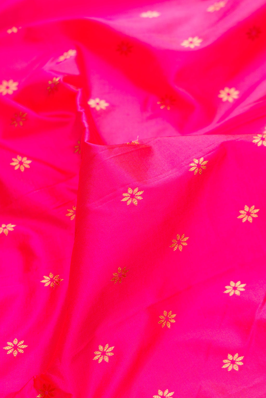 Close up of Pure Silk Pink Paithani Saree with Zari And Thread Butta on the body and Zari Border.  displaying folds