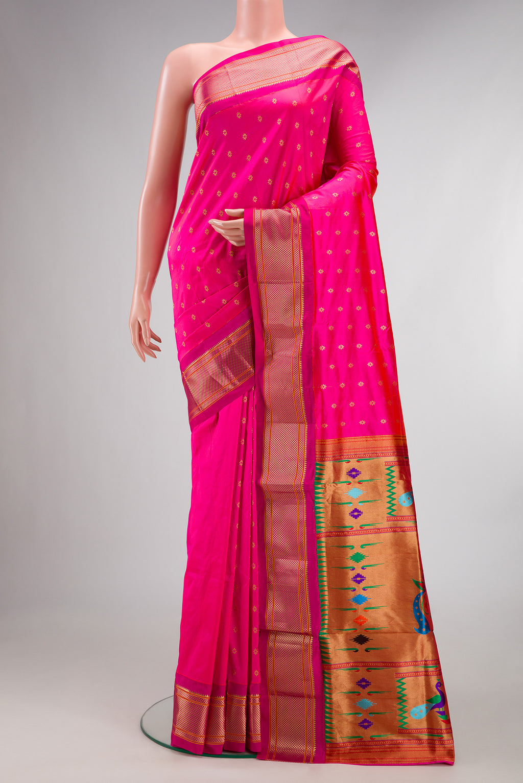 Pure Silk Pink Paithani Saree with Zari And Thread Butta on the body and Zari Border.  displayed on a mannequin