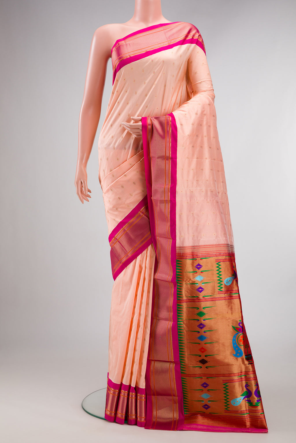 Pure Silk Peach Paithani Saree with Zari And Thread Butta on the body and Zari Border.  displayed on a mannequin