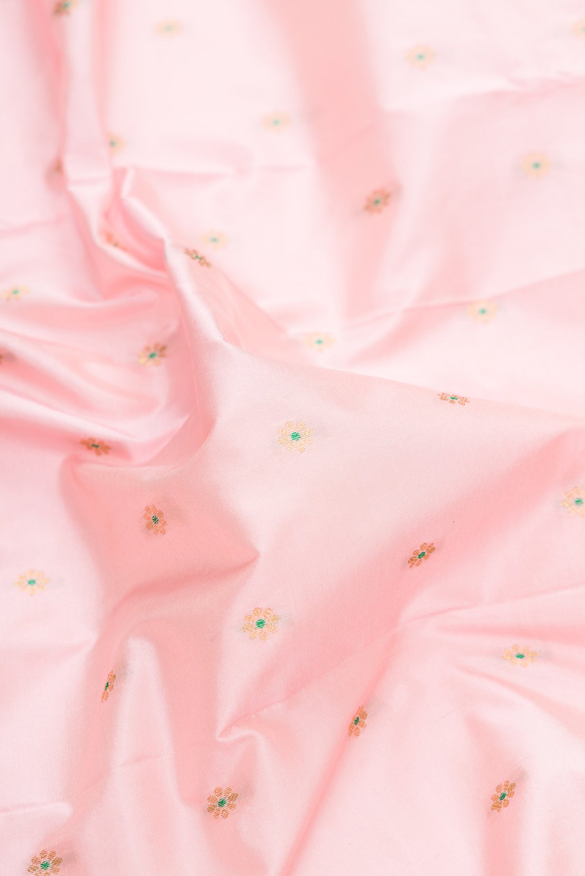 Close up of Pure Silk Rose pink Paithani Saree with Zari And Thread Butta on the body and Zari Border.  displaying folds