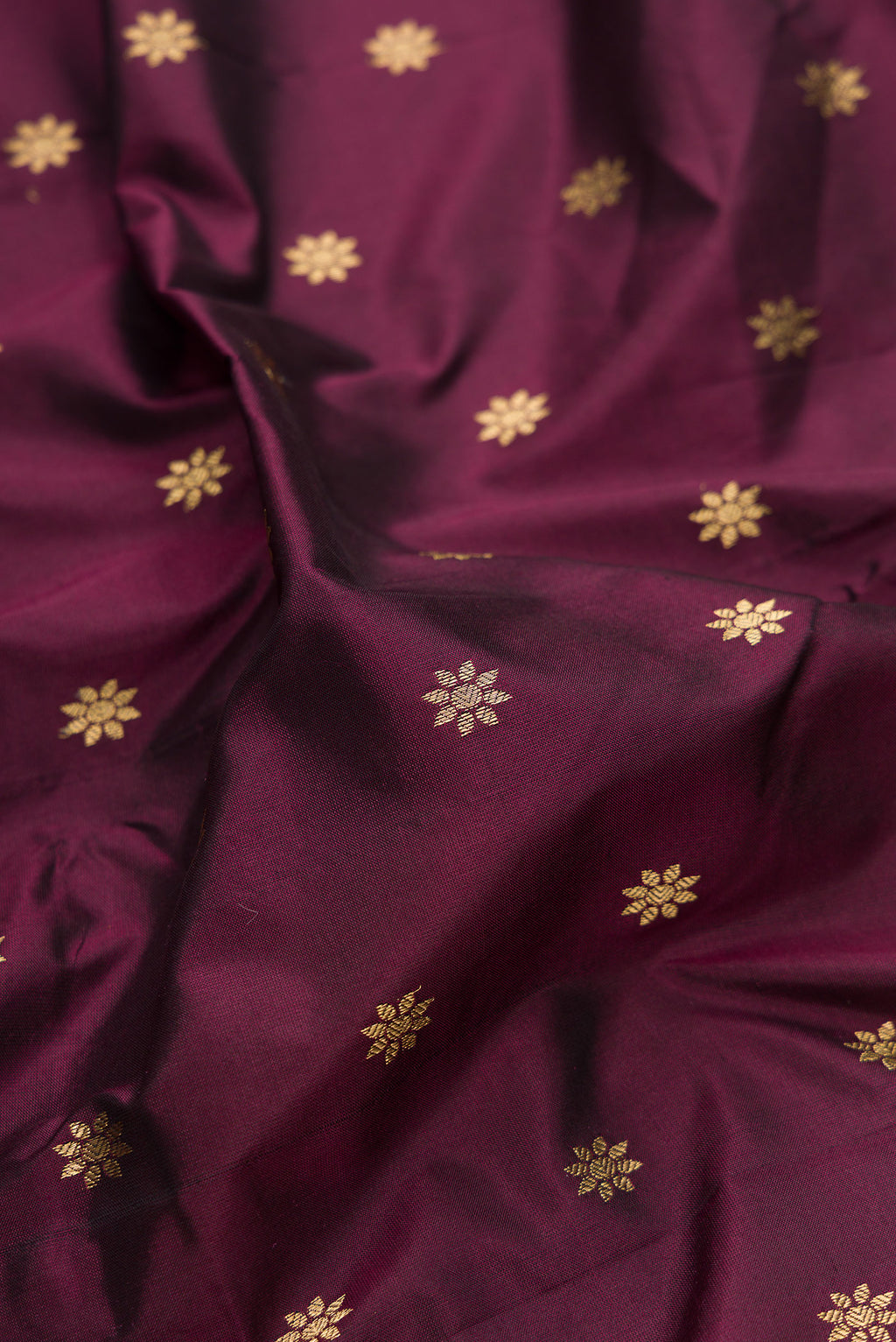 Close up of Pure Silk Coffee Brown Paithani Saree with Zari Butta on the body and Zari Border.  displaying folds